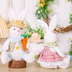 Detailed view of Easter bunny plush figures holding carrots for festive home decoration