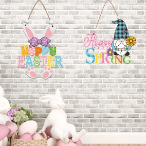 Close-up of Easter wooden signs with rabbit and gnome themes hanging on a gray wall