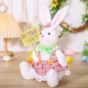 Easter plush bunny detail with pink plaid dress and yellow wooden Easter Hunt sign