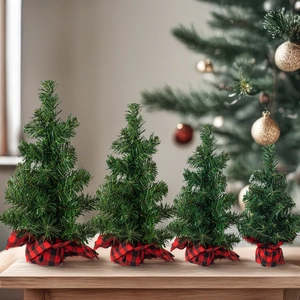 Set of 4 mini artificial Christmas trees with buffalo plaid base for tabletop decoration
