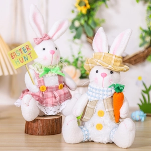 Easter plush bunny pair with checkered outfits holding Easter Hunt sign and carrot
