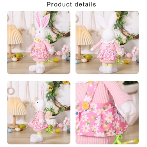 Detailed close-up of plush Easter bunny doll wearing pink floral dress with daisy patterns