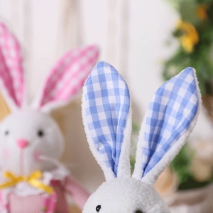 Detailed close-up of soft Easter plush rabbits with blue gingham and pink polka dot ears