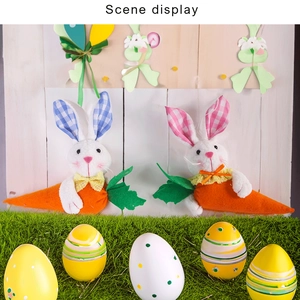 Detail showing plush Easter bunnies with carrots and colorful painted eggs set decoration