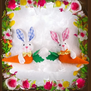 Close-up of Easter plush bunny pair with plaid ears and carrot decorations on fur rug