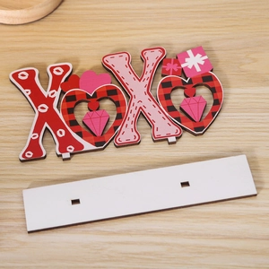 Detail of XOXO wooden heart centerpiece with red plaid design on white base