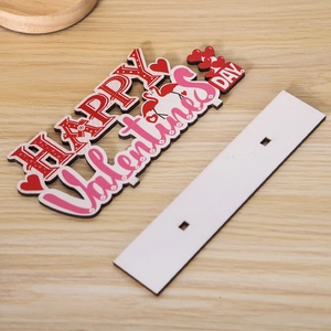 Detail of wooden Valentine's Day sign with flamingo and pink heart on a white base