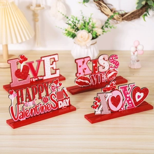 Close-up of four Valentine's Day wood signs with heart, truck, and LOVE designs