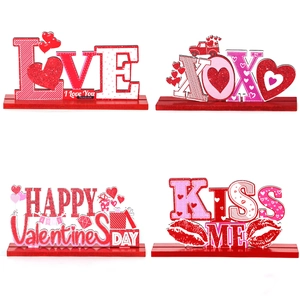 Set of four Valentine's Day glitter wooden table signs featuring LOVE and XOXO heart designs