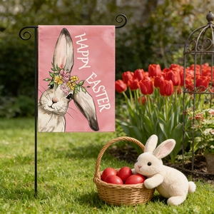 Close-up of Easter garden flag with bunny illustration and Happy Easter text in the garden