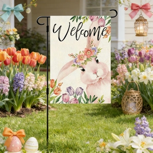 Detailed close-up of double-sided Easter bunny garden flag with tulips in a garden
