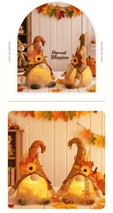 Close-up of LED glowing fall gnomes with sunflowers, maple leaves and harvest blessings text