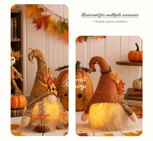 Detail of light-up autumn gnome plush with sunflower and maple leaf for harvest decor