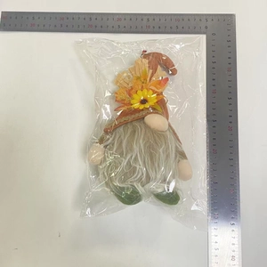 Detail view of gnome plush doll with sunflower hat measured at 30cm height with a ruler