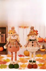 Detail of harvest scarecrow dolls with plaid shirts and sunflower accents on a warm shelf