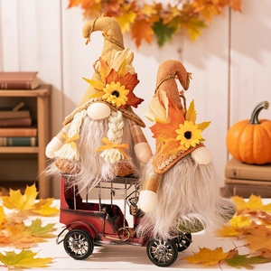 Fall harvest gnome plush figures with sunflowers on a red vintage car model decor