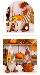 Close-up of autumn harvest gnomes with sunflowers, pumpkins and fall maple leaves