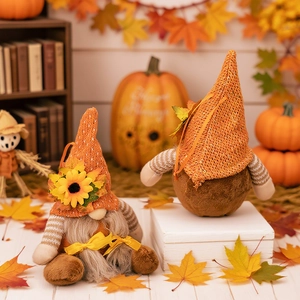 Autumn gnome plush couple with knitted hats and sunflowers for fall harvest decoration