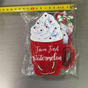 Detail of wooden watermelon cup decoration featuring Farm Fresh text and measuring tape