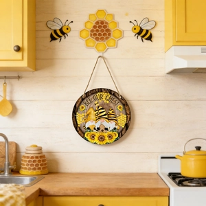 Detail of round wooden bee gnome sign with Bee Our Guest text in a warm kitchen setting