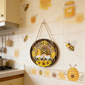 Round wooden hanging sign featuring bee gnomes and Bee Our Guest greeting for home decor