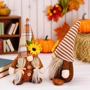 Pair of autumn harvest gnomes with sunflowers and plaid hats for seasonal decor