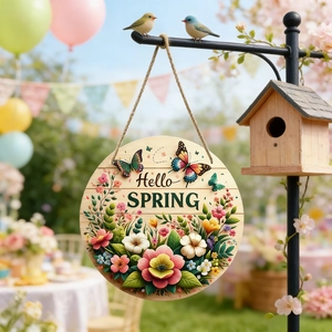 Close-up of wooden Hello Spring hanging sign with colorful floral patterns and a birdhouse