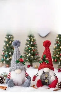 Macro detail of Nordic Christmas gnomes with knitted hats and holiday berry accents