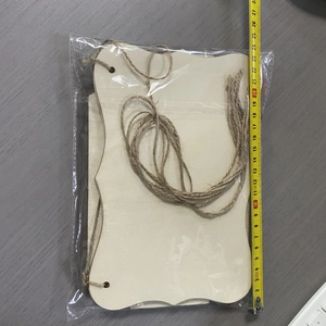 Measurement of 26cm unfinished wavy wood sign set with twine in plastic bag