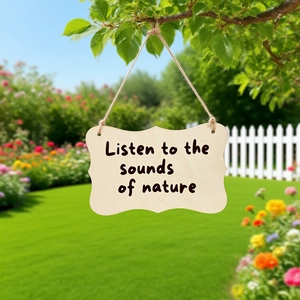 Wooden hanging sign with nature quote on rustic branch in a bright sunny garden setting