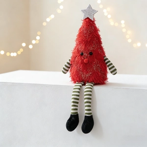 Detailed view of the plush Christmas tree doll with long striped legs and soft red fur