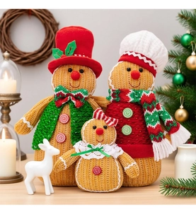 Detail of Christmas gingerbread man family plush set with knitted texture and holiday scarf
