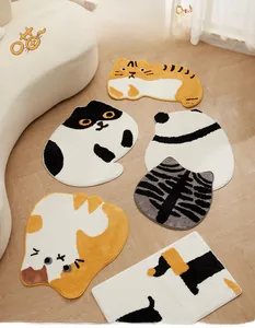 Detailed view of 3D tufted cartoon cat and panda floor mats on a light wood floor