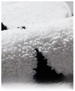 Close-up of thick cream style cake fleece rug showing soft texture and plush fibers