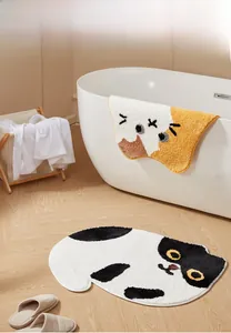 Detail view of plush cat-shaped bathroom mats with absorbent soft texture for home decor