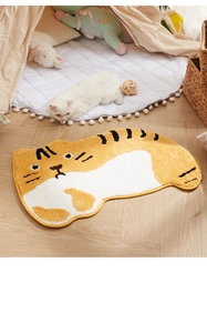 Detail of soft yellow tiger pattern plush rug with non-slip texture for bathroom