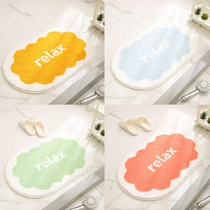 Absorbent cream-style bathroom rugs with non-slip backing in four assorted soft colors