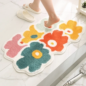 Absorbent floral bathroom rug with colorful flower patterns and non-slip backing