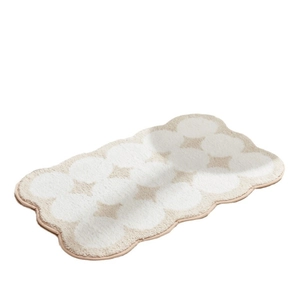 Irregular wave-shaped cream area rug with dotted pattern for bedroom and bathroom decor