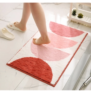 Detailed view of the soft plush texture and geometric patterns on a modern bath mat
