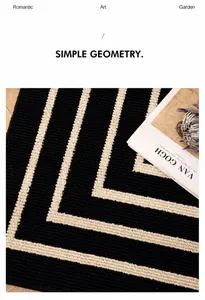 Detail of minimalist geometric black and white rug with textured loop pile weaving