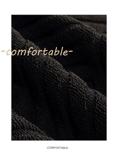 Macro detail of high-density black polypropylene carpet fiber with 3D wavy texture