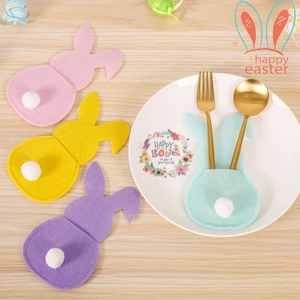 Close-up of Easter bunny felt cutlery holders in pink, yellow, purple and mint green colors