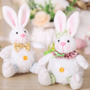 Close-up of plush white Easter bunnies with fuzzy texture and decorative collars