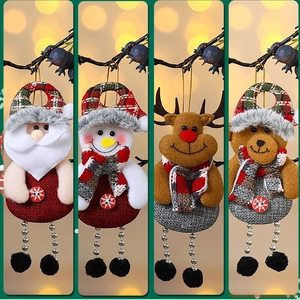 Detail of Christmas plush hanging ornaments featuring Santa, Snowman, Reindeer, and Bear