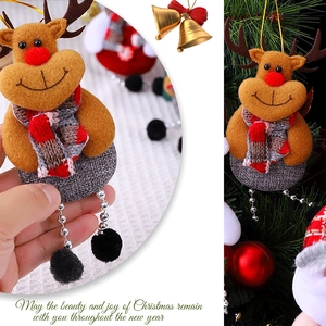 Detail of Christmas reindeer plush ornament with red scarf and silver beaded legs
