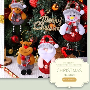 Detail of Christmas tree plush ornaments featuring Santa and snowman with knit scarves