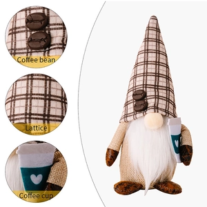 Detail view of coffee gnome featuring lattice hat with beans and heart coffee cup