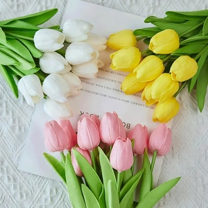 Detail of lifelike PU mini tulips in white, yellow, and pink colors for home decoration
