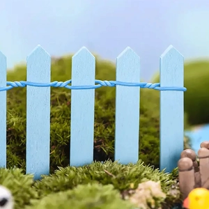 Macro shot of blue miniature wooden fence with flexible wire for DIY moss micro landscapes